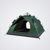 Green camping tent with black floor on a light grey background