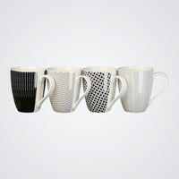 Set of four mugs with different patterns on a Light background