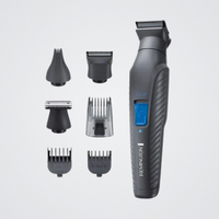Revolusion grooming tool with attachments on a light gray background