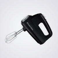 Black hand mixer with whisk attachment on a light grey background