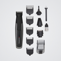 Remington hair trimmer set with various attachments on a light gray background