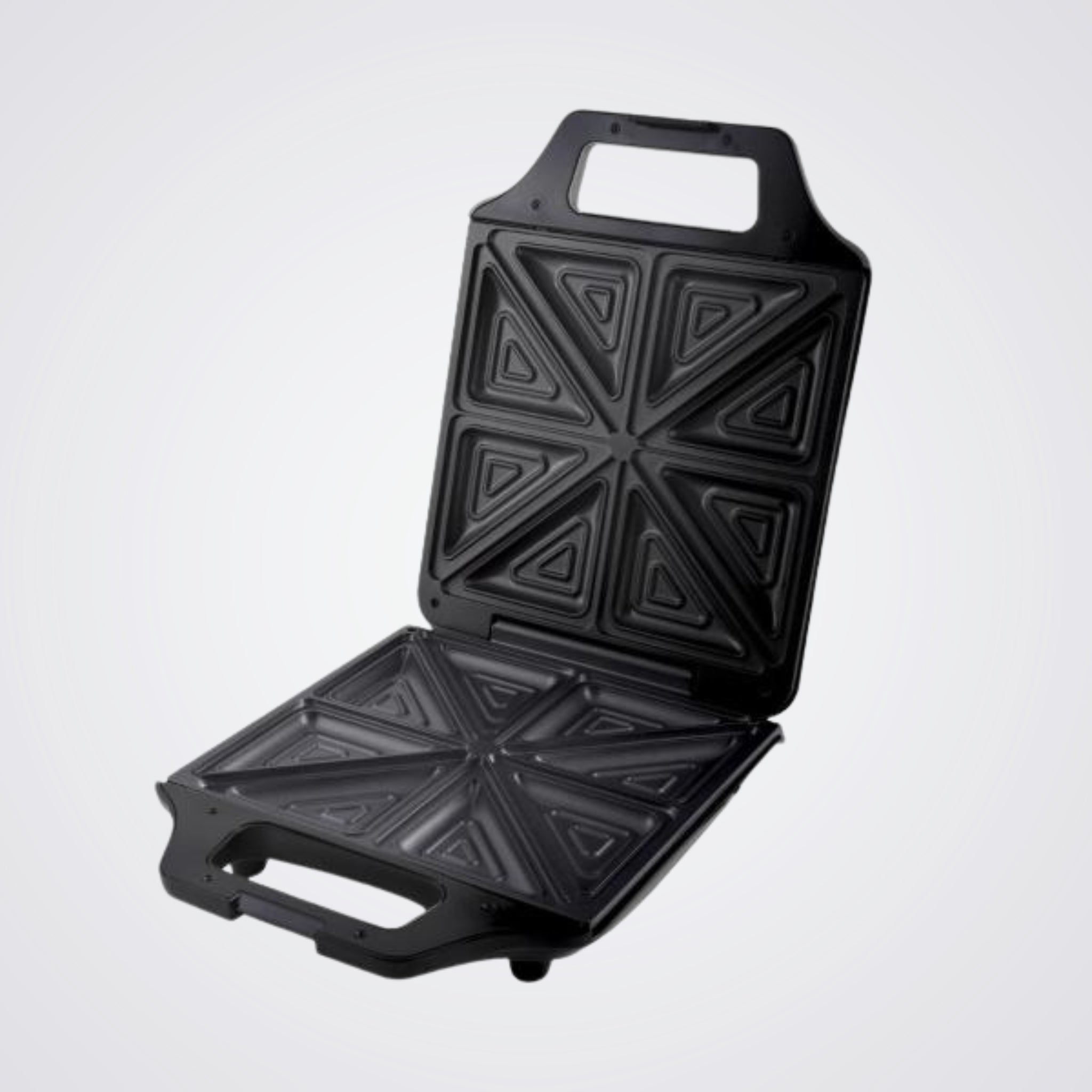 Black Westinghouse sandwich toaster open with geometric patterns on a Light background