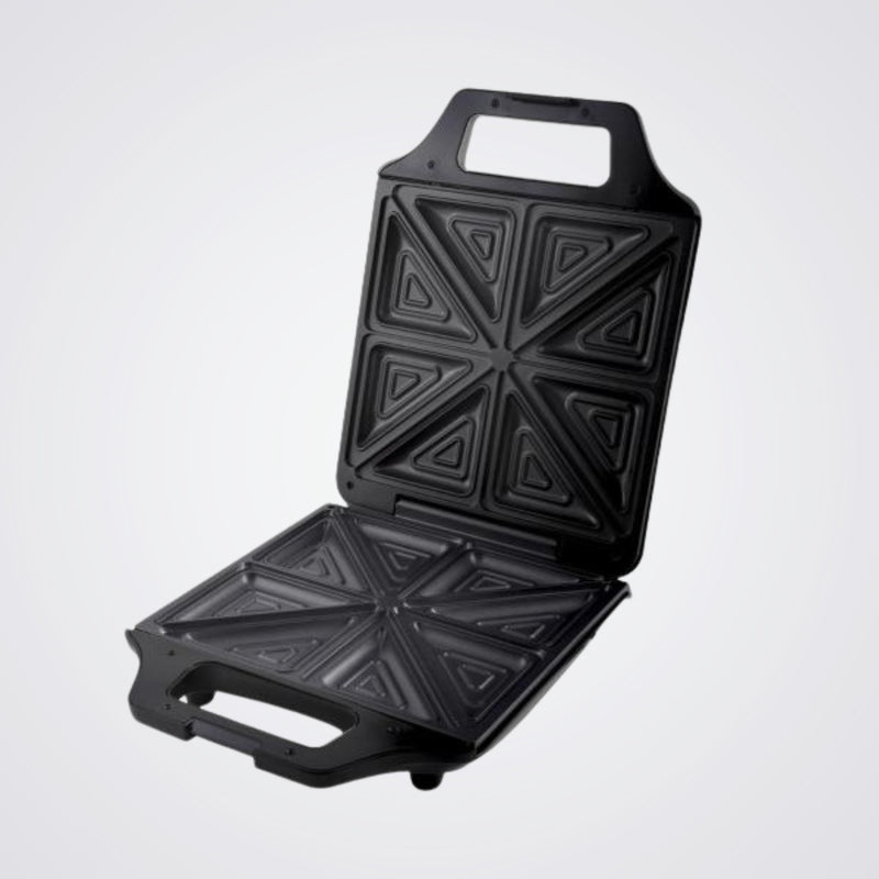 Black Westinghouse sandwich toaster open with geometric patterns on a Light background