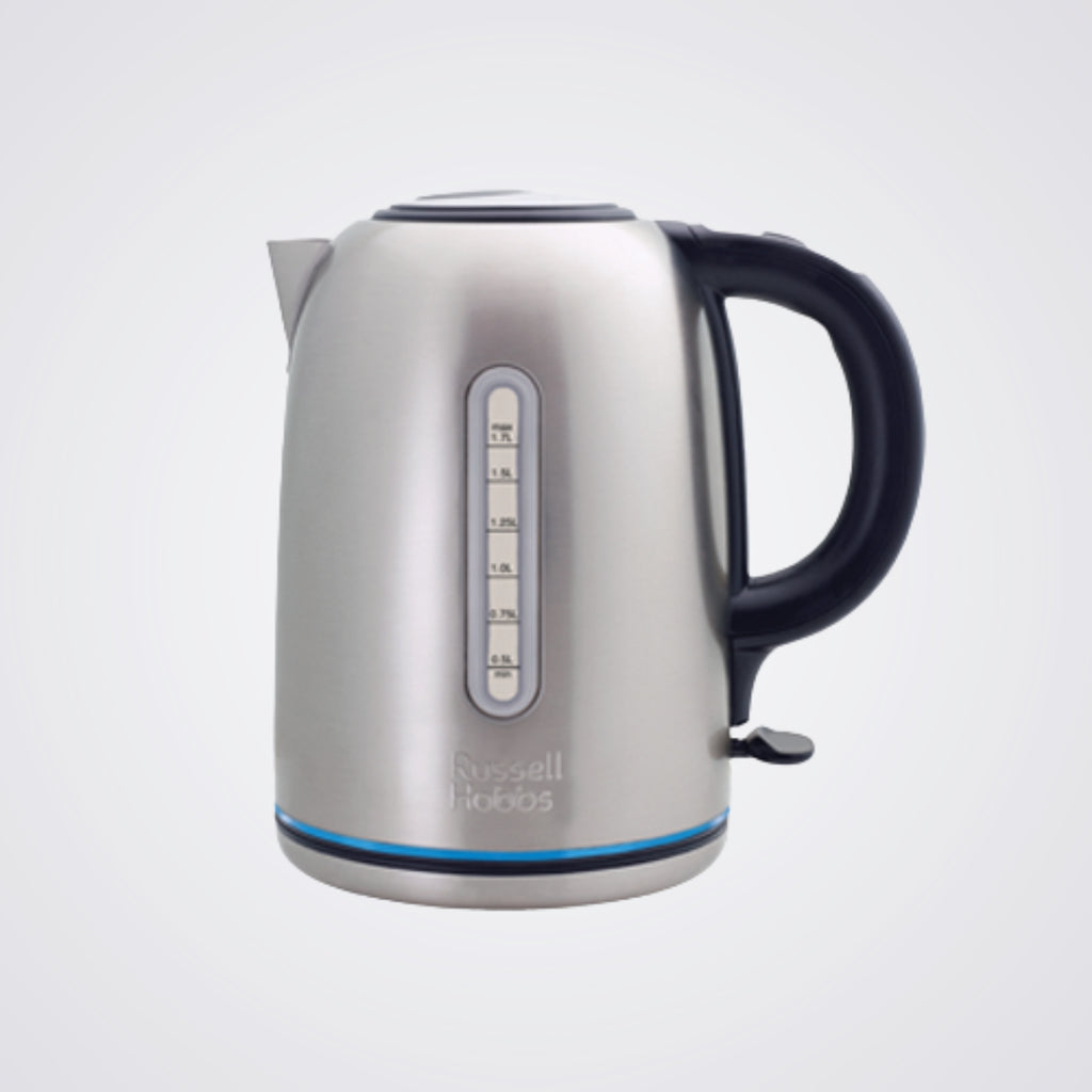 Silver electric kettle with black handle on a light background