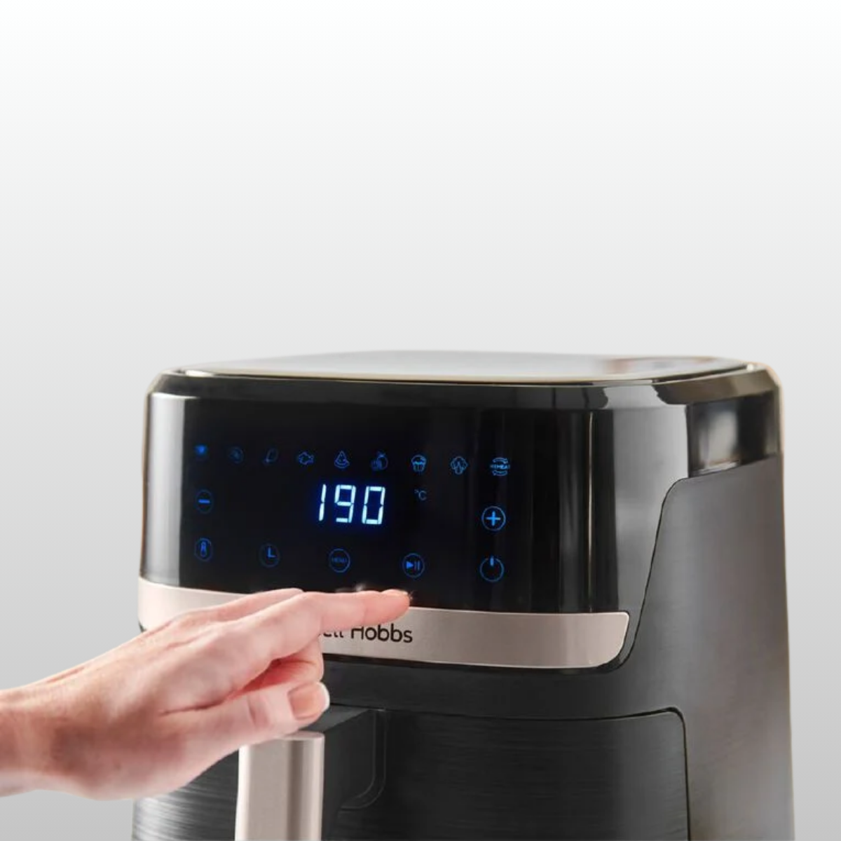 Russell Hobbs 5.5Litre Airfryer with hand reaching to Press button