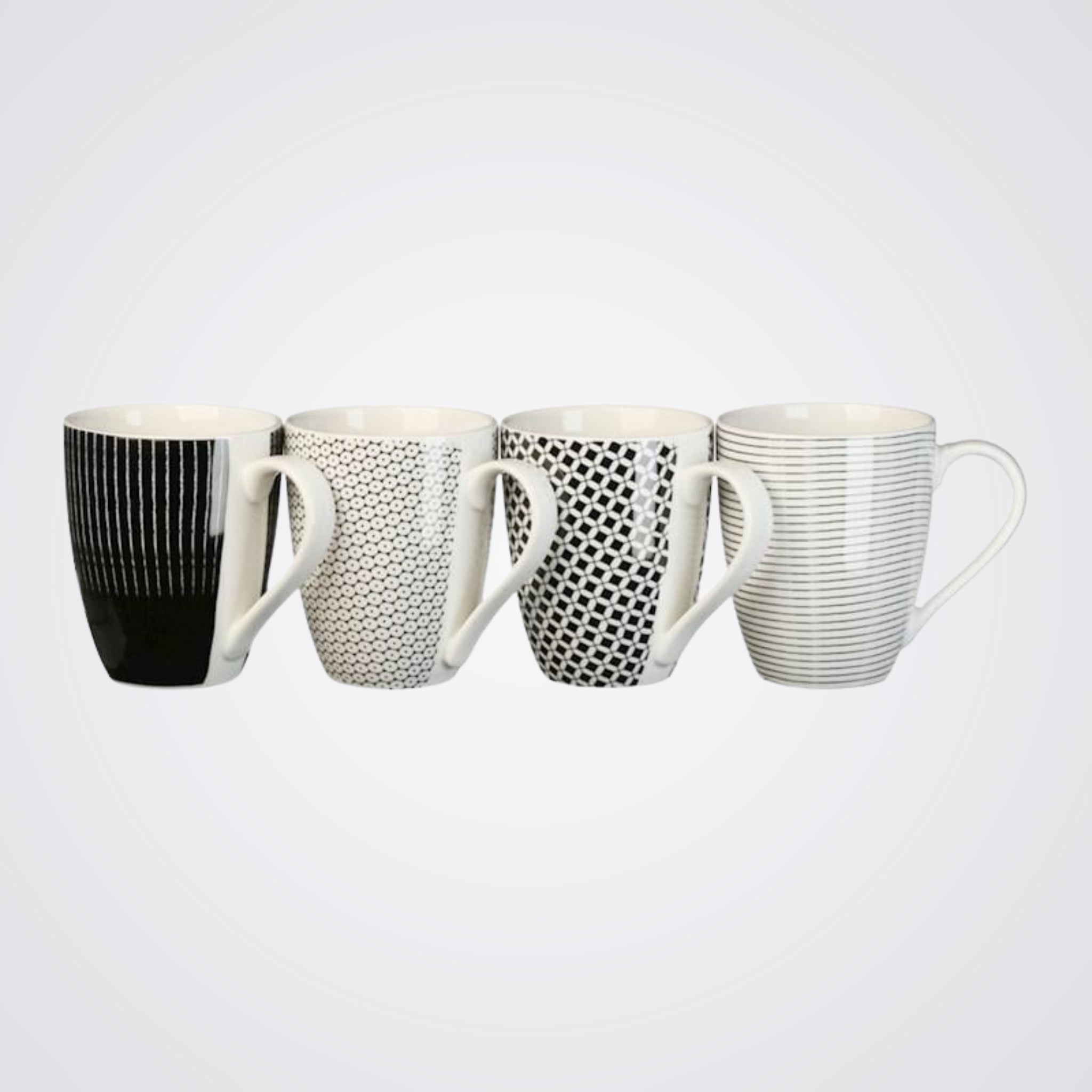 Set of four mugs with different patterns on a Light background