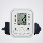 Digital blood pressure monitor on a light background