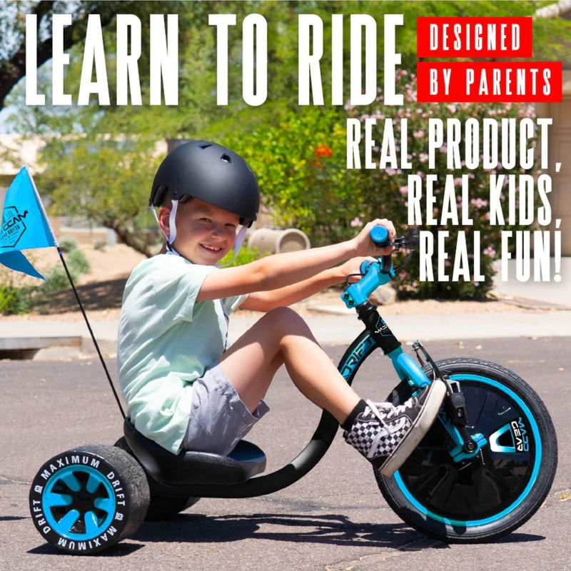 Child riding the blue and black Madd Gear Drift Trike