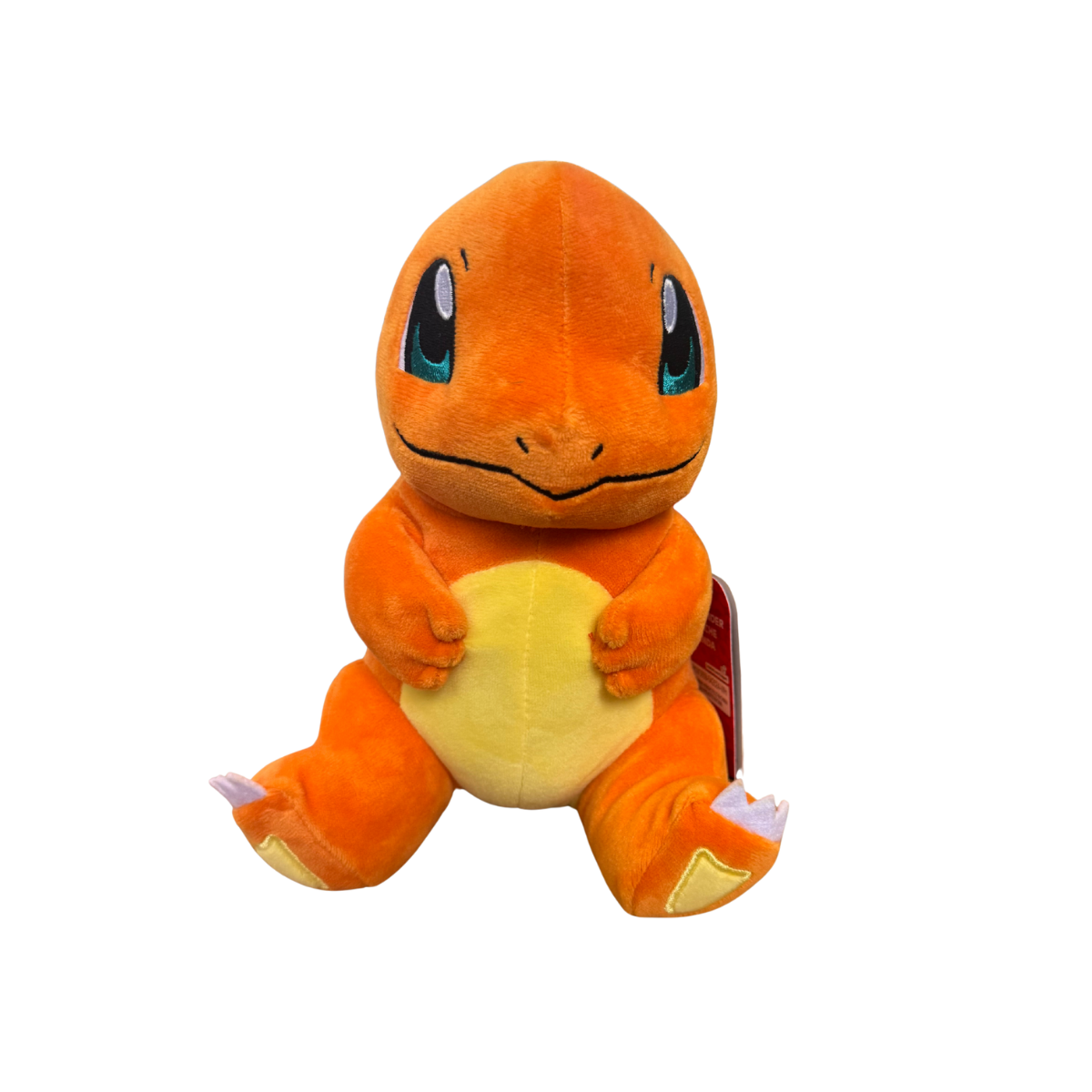 Plush toy of a dragon-like creature Charmander on a white background