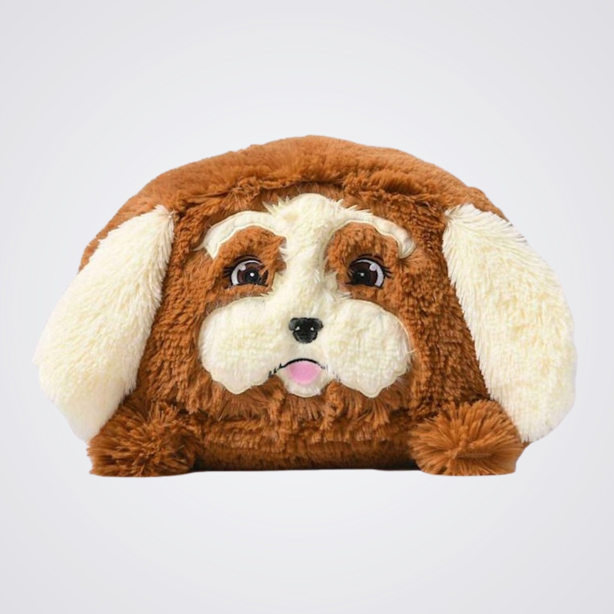 Plush dog-shaped pillow with brown and white fur on a light grey background