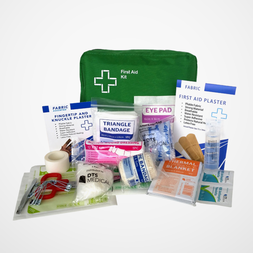 First aid kit with various supplies on a white background
