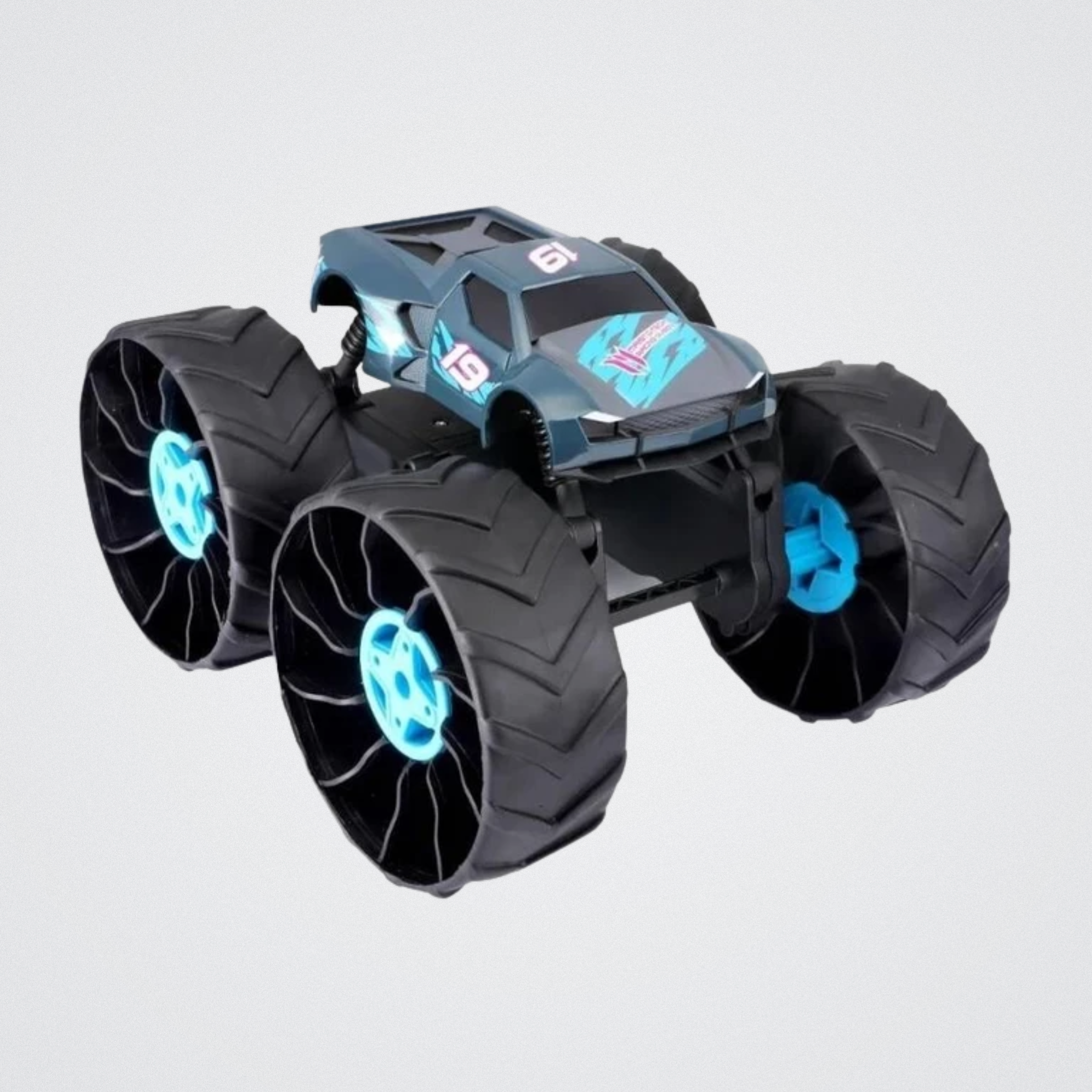 Toy monster truck with large wheels on a light gray background