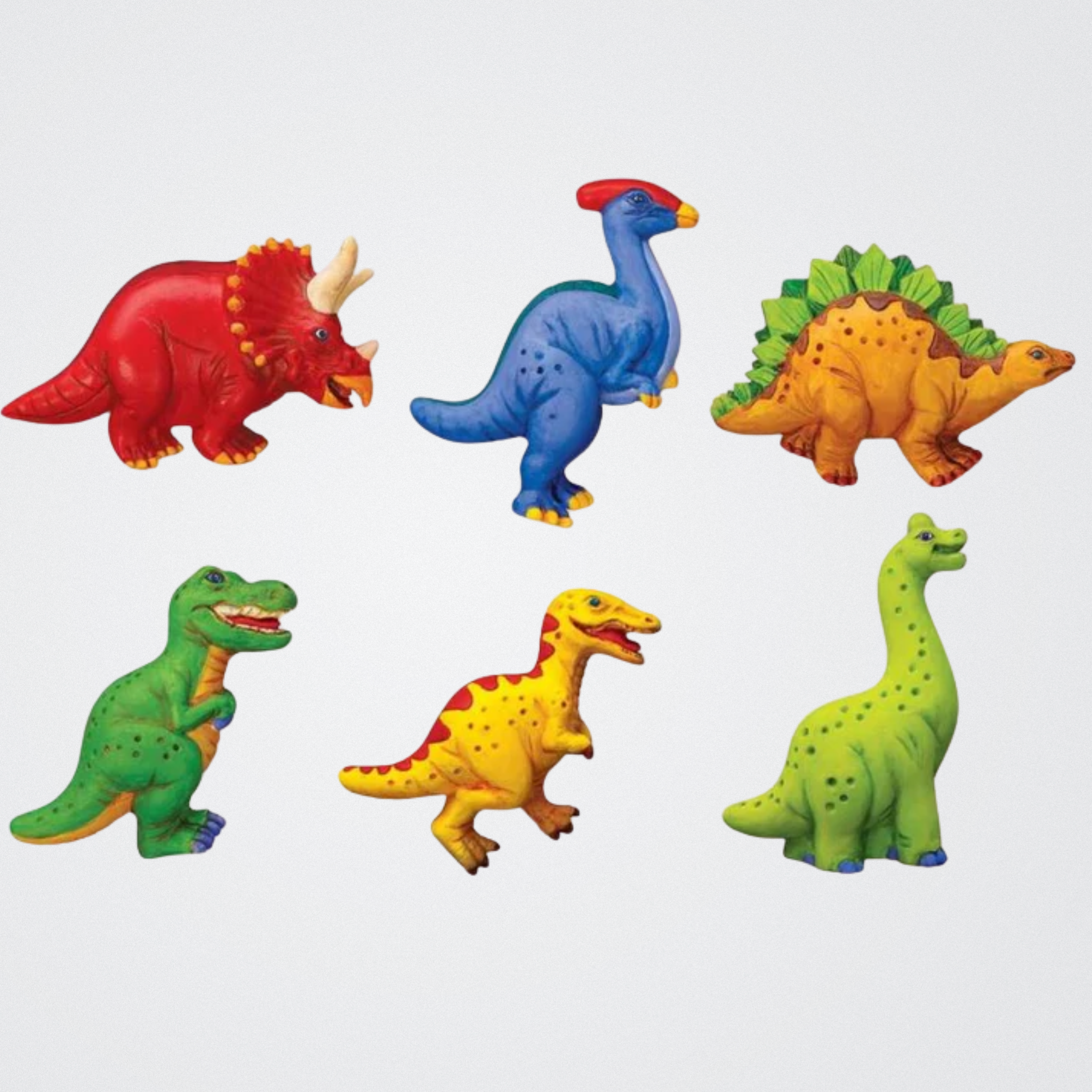 Set of colorful dinosaur figurines on a white background