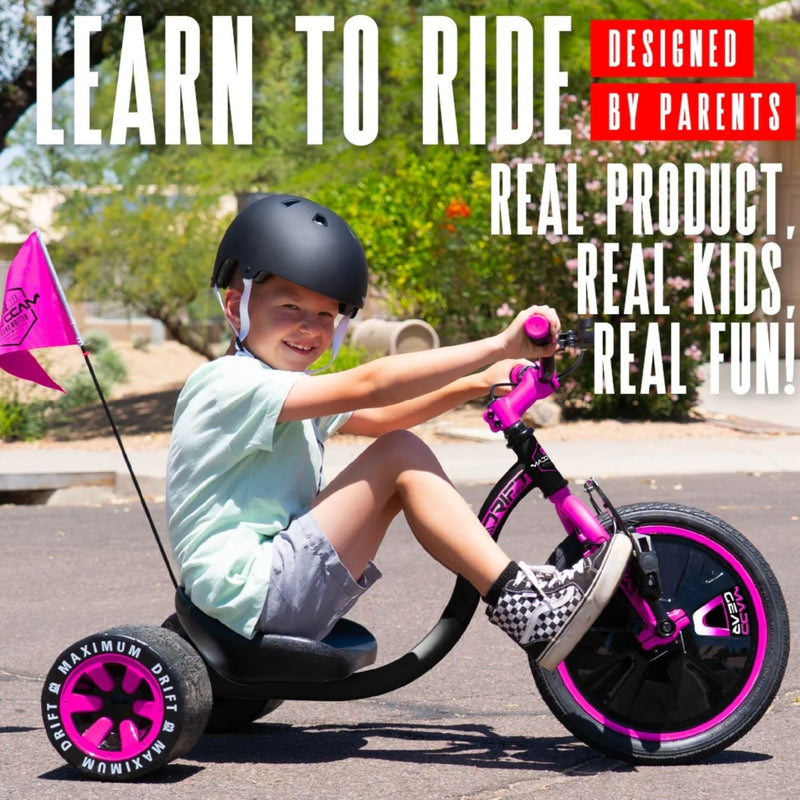 Child riding the pink and black Madd Gear Drift Trike