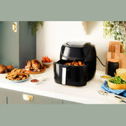 Russell Hobbs SatisFry 8L air fryer with cooked food on the kitchen bench