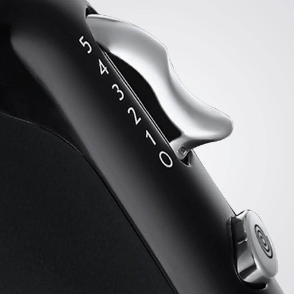 Close-up of a black and silver device with '54321' branding on a light gray background