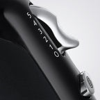 Close-up of a black and silver device with '54321' branding on a light gray background