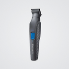 Gray Remington grooming tool on a light gray background