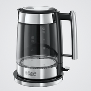 Glass electric kettle with black base and handle on a light gray background, featuring the Russell Hobbs logo.