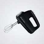 Black hand mixer with whisk attachment on a light grey background
