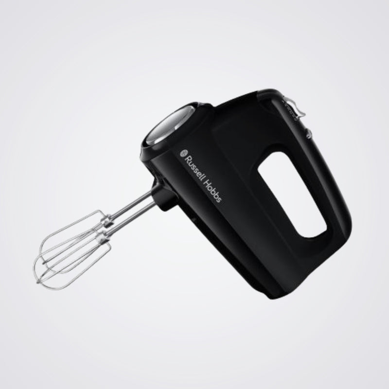 Black hand mixer with whisk attachment on a light grey background