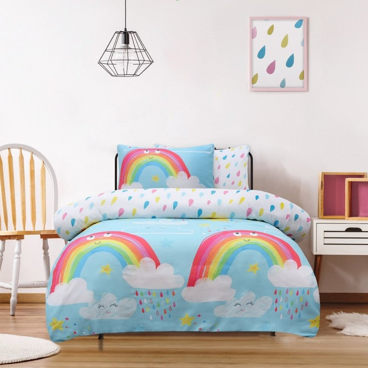 Children's bedroom with rainbow and cloud patterned bedding