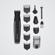 Remington hair trimmer set with various attachments on a light gray background