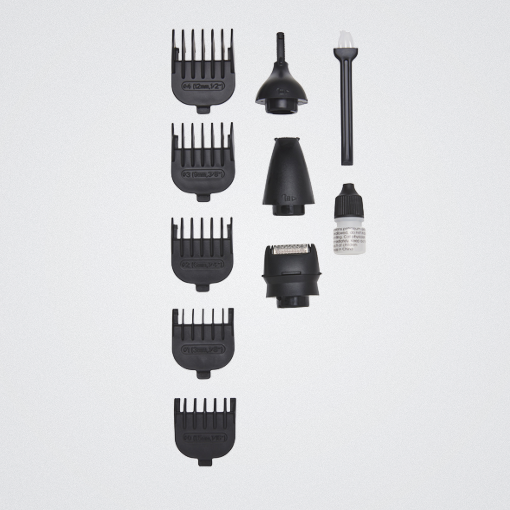 Set of black hair styling tools on a light gray background