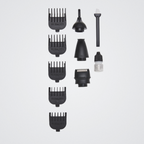Set of black hair styling tools on a light gray background