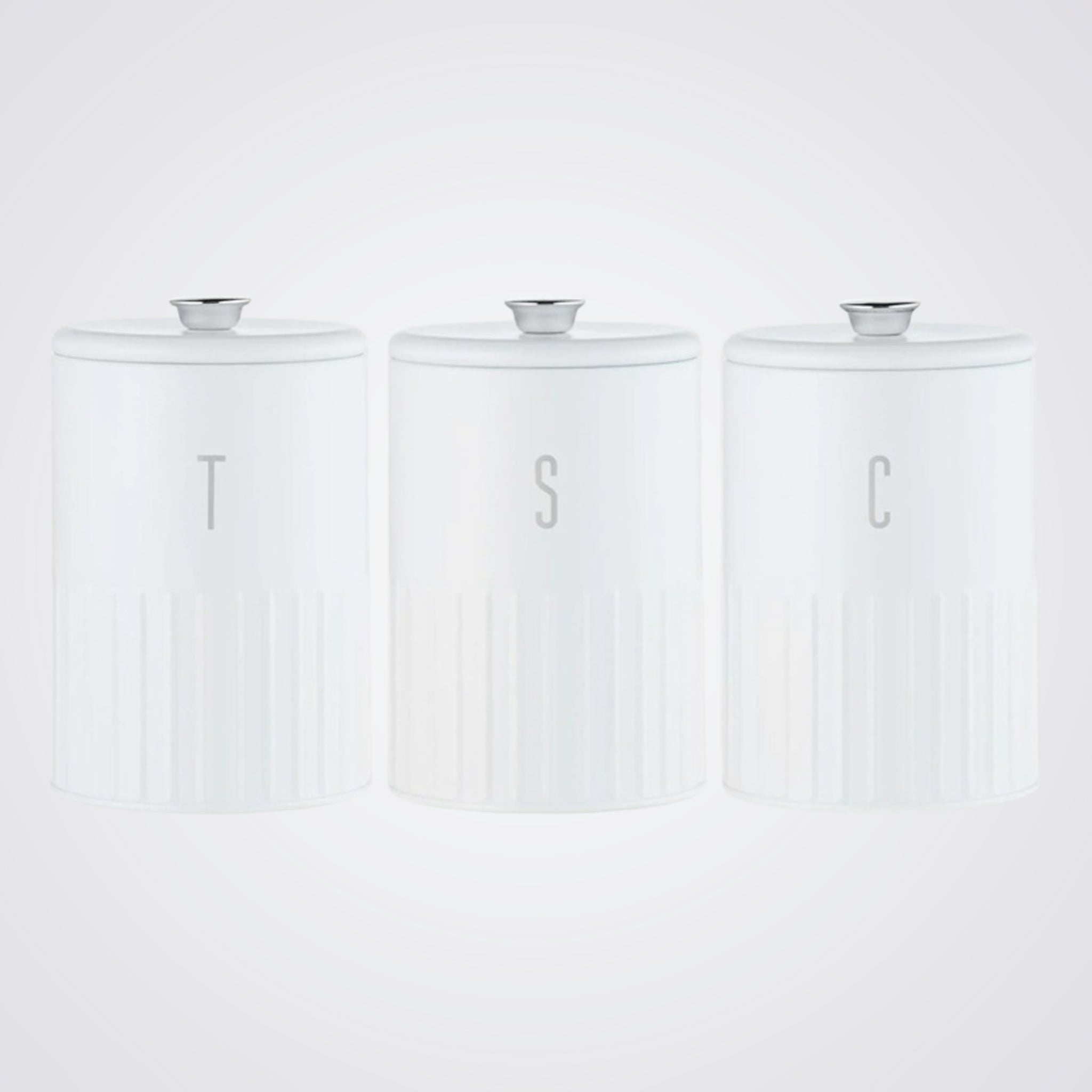 Three white Glass cylindrical containers with silver lids on a light grey background