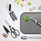 Scissors, Peeler, Can Opener, Garlic Crusher, Measuring Spoons & Cups, Tongs, Chopping Board, Black Grey and Stainless steel  